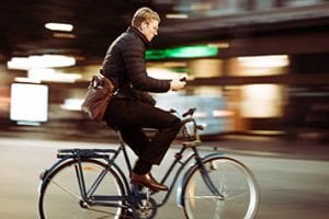 Man riding a bike in an urban setting