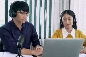 Image of a male and female in a podcast interview