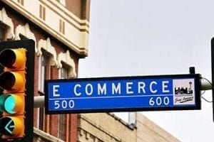 Photo of a street sign reading "E Commerce."