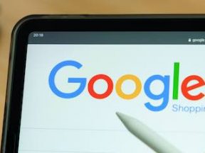 Image of a tablet the Google Shopping logo on the screen
