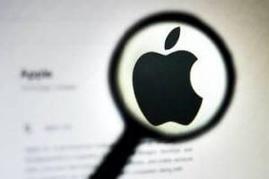 Image of the Apple logo in a magnifying glass