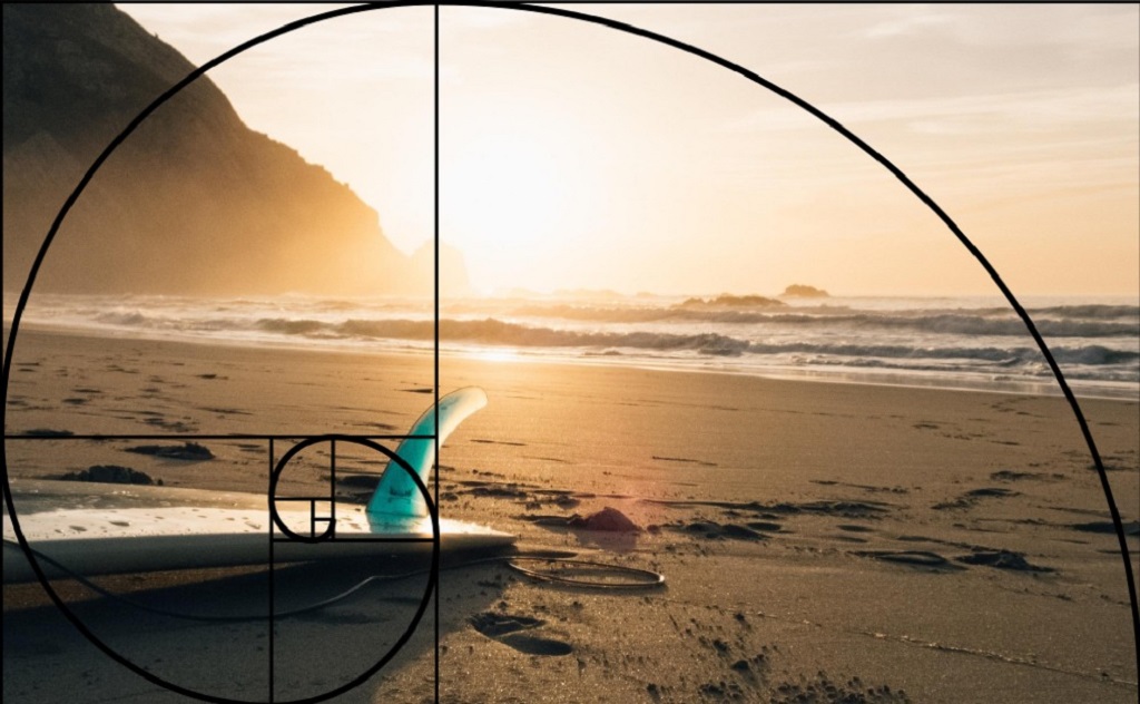 The composition of this image follows the Golden Ratio, with the surfboard at the endpoint of the spiral. Source: Fotowoosh.com.