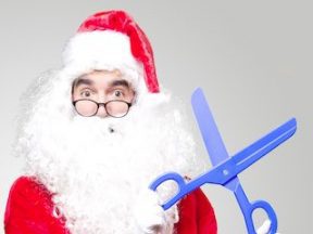 Photo of Santa Claus holding scissors