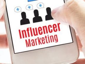 Image of a smartphone screen showing the text "Influencer marketing"