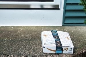 Photo of an Amazon package on a front porch