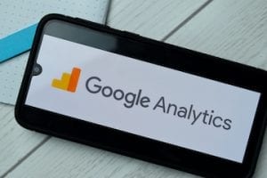 Image of a smartphone with a Google Analytics logo on the screen